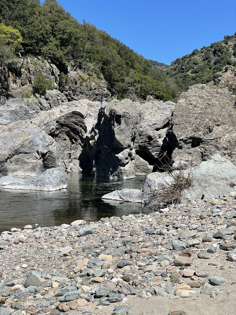 A pebble beach in the gorge below the village